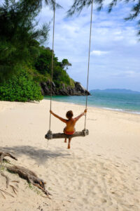 Enjoying time on a beachside swing at the Koh Lanta National Park