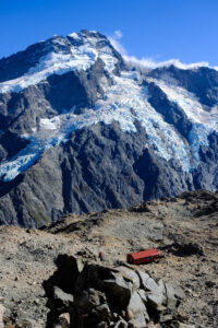 This photo was taking from the ridge line on Mount Olliver, looking back towards the Mueller Hut and the enormous Mueller Glacier! #muellerhut #muellerglacier